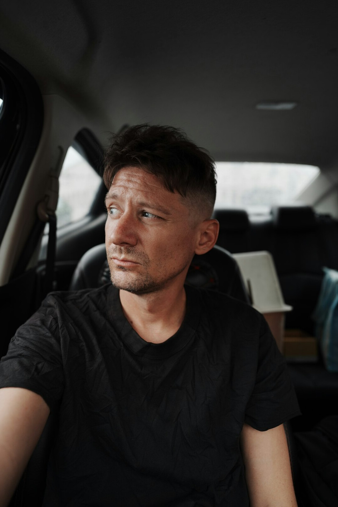 Portrait of a man with a short beard looking at the camera
