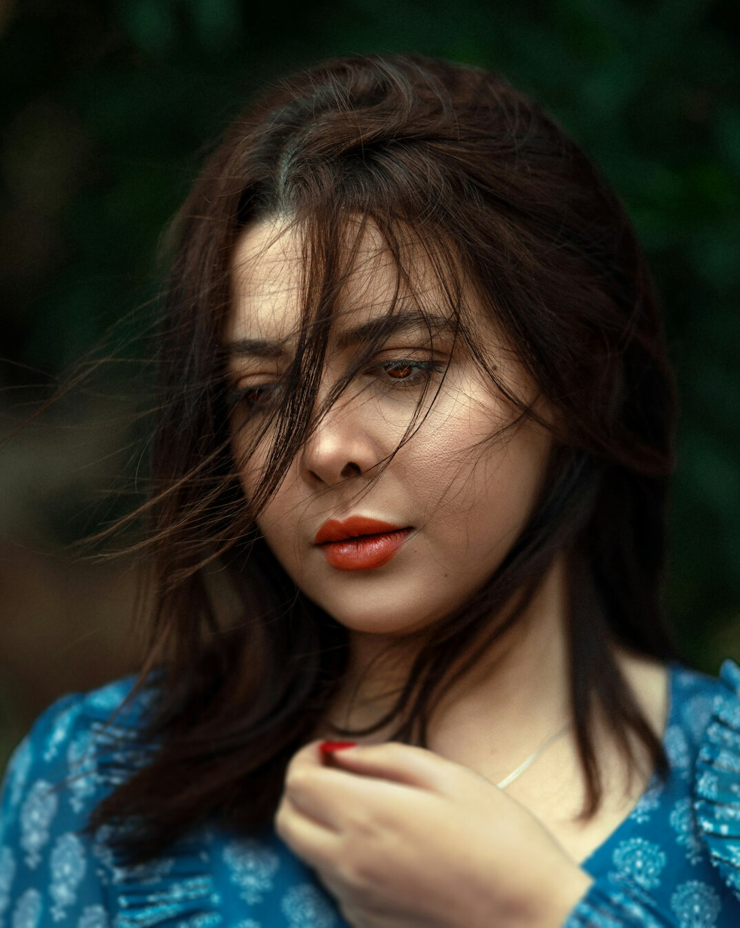 Portrait of a woman with dark hair in a professional setting
